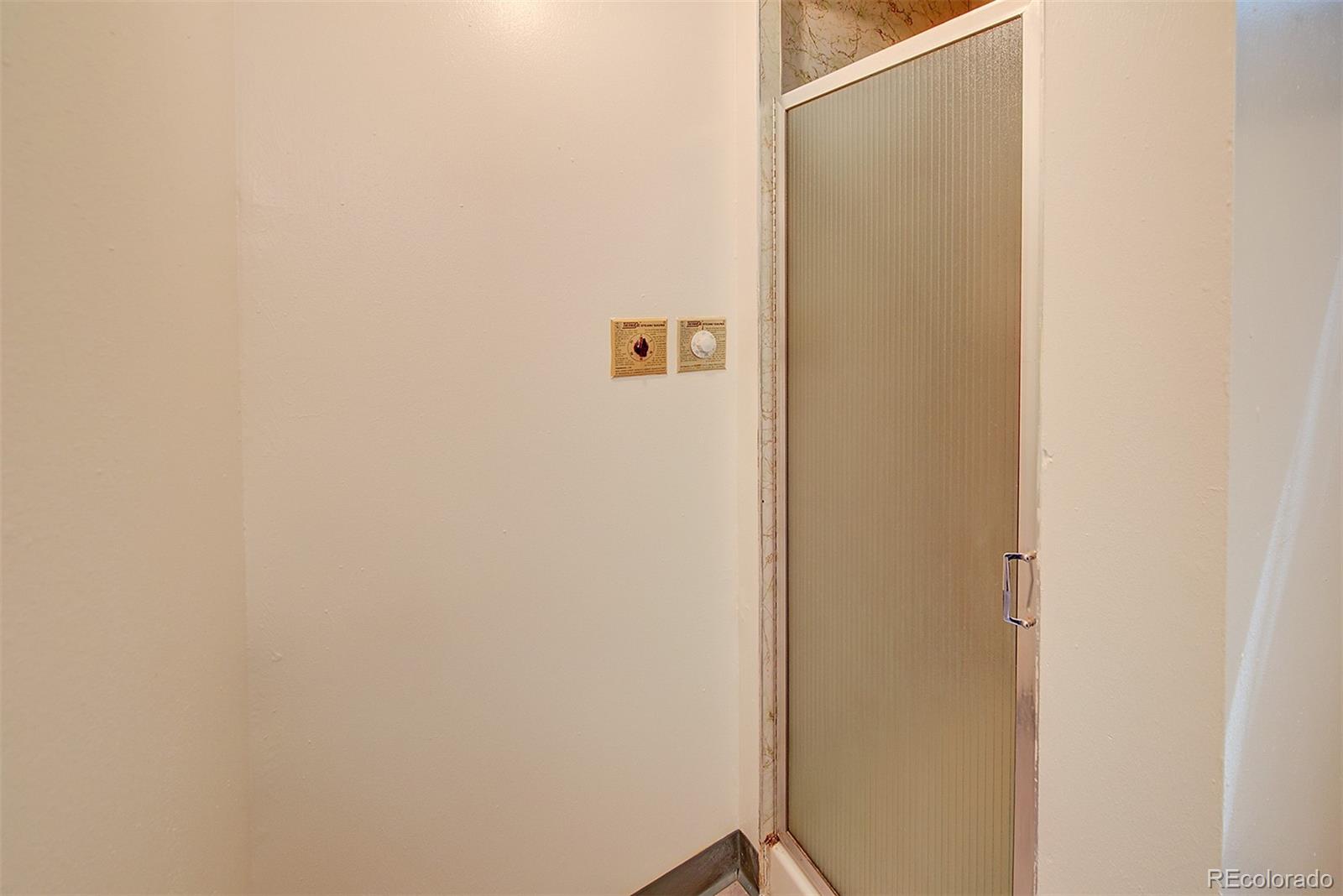 6054 Iris Way Arvada, CO 80004 - Photo 32 of 44 a view of a hallway