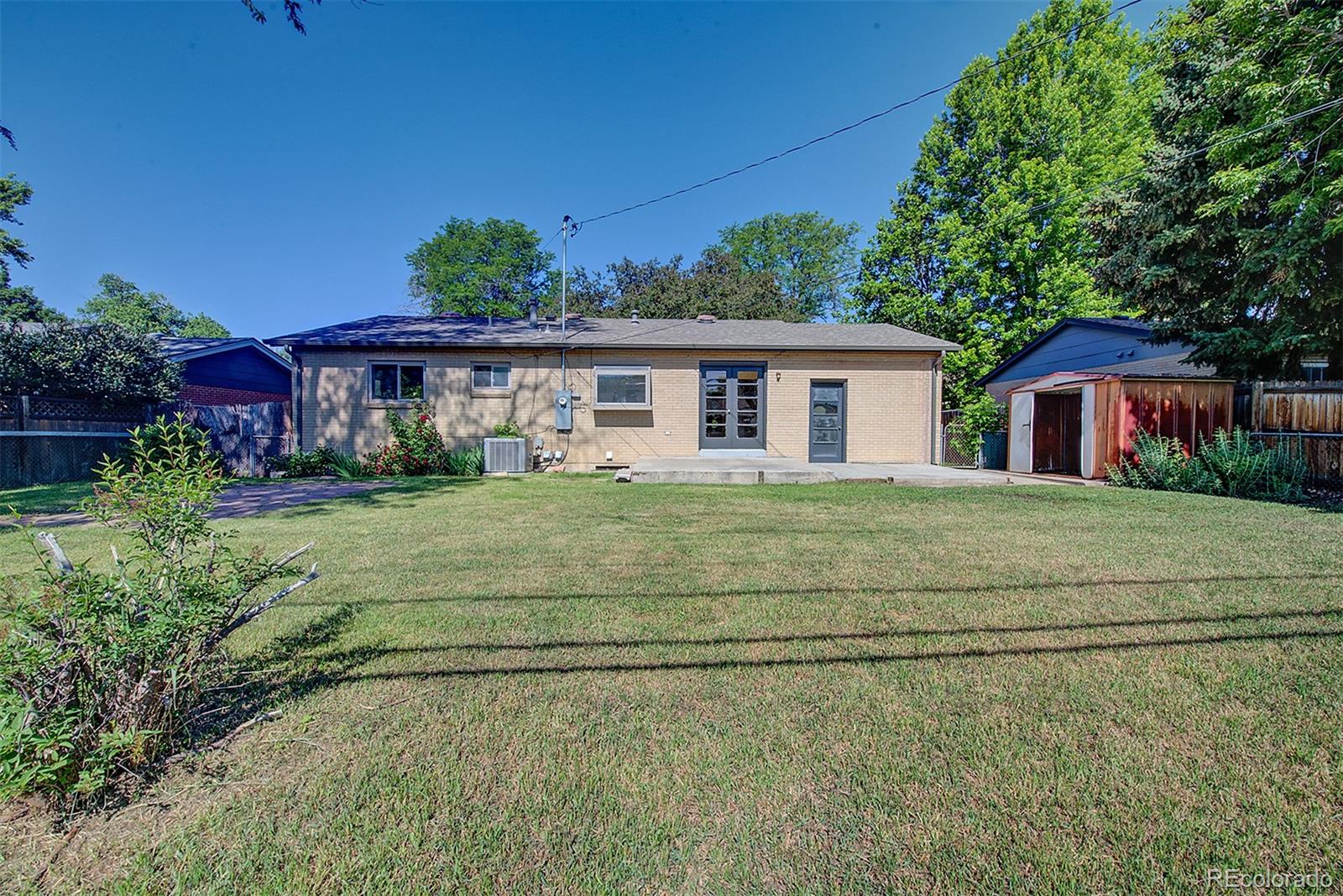 6054 Iris Way Arvada, CO 80004 - Photo 39 of 44 a view front of house with a yard
