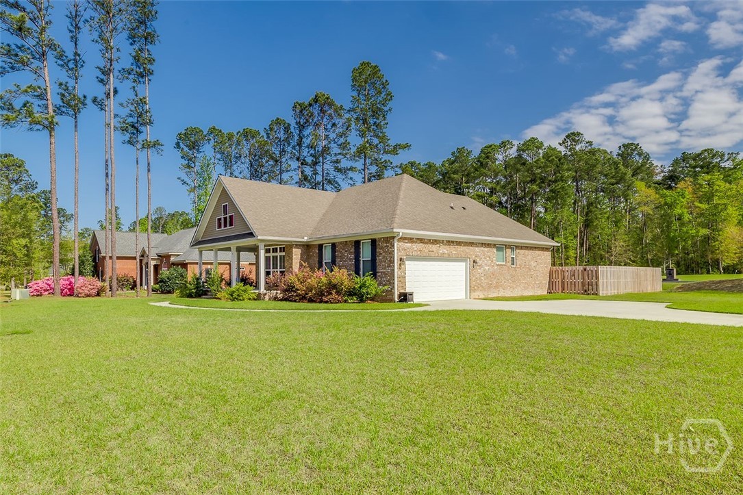 120 Sweetwater Circle Rincon, GA 31326 - Photo 3 of 48 This brick home sits on a large corner lot with a side, extra large driveway with a turn-around space