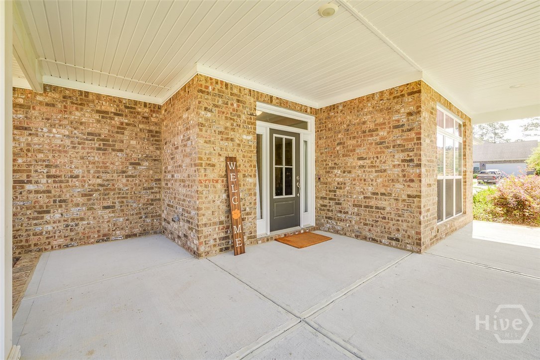 120 Sweetwater Circle Rincon, GA 31326 - Photo 4 of 48 Extra large covered front porch awaiting your rocking chairs or bench.
