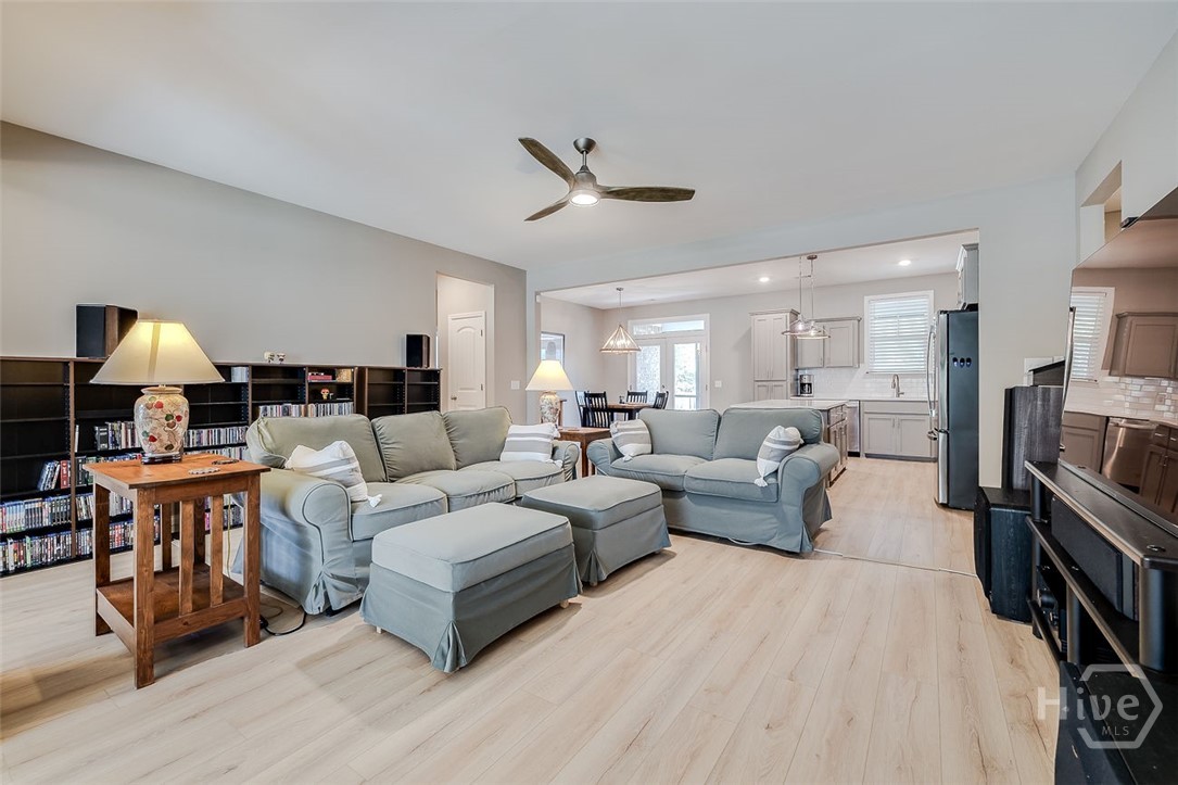 120 Sweetwater Circle Rincon, GA 31326 - Photo 8 of 48 Welcome to the great room, and this high-end LVP flooring is throughout the home except for tile in the bathrooms