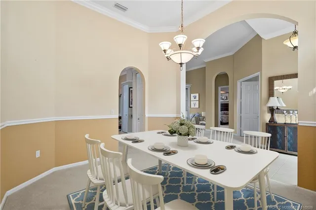 a bedroom with a bed and a chair