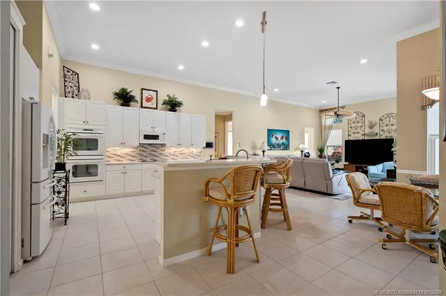 a view of a workspace with furniture and a cabinet