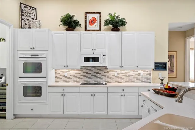 a view of a workspace with furniture and a living room