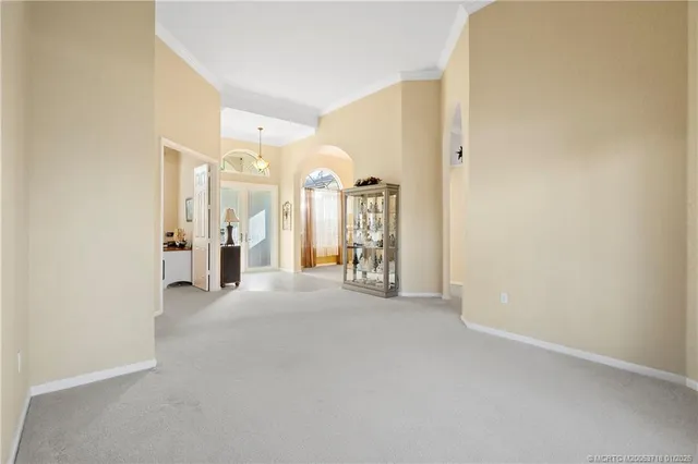 a spacious bedroom with a bed and a couch