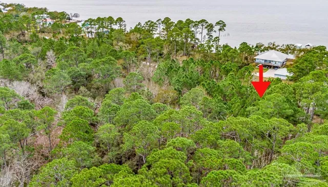 a view of swimming pool with sitting area and garden