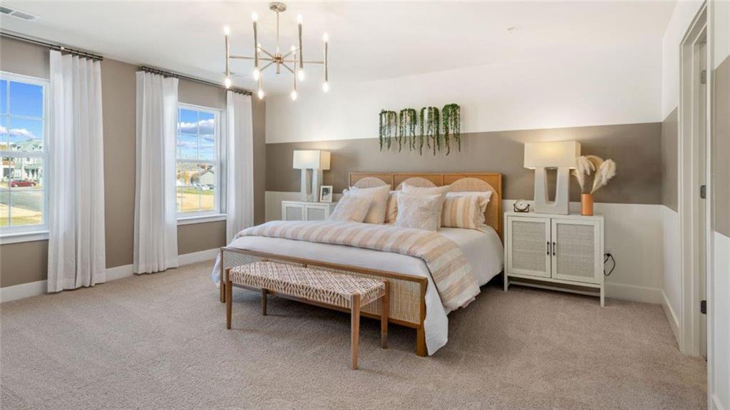 100 Crabapple Lane Beaver Falls, PA 15010 - Photo 20 of 28 a spacious bedroom with a bed and a chandelier