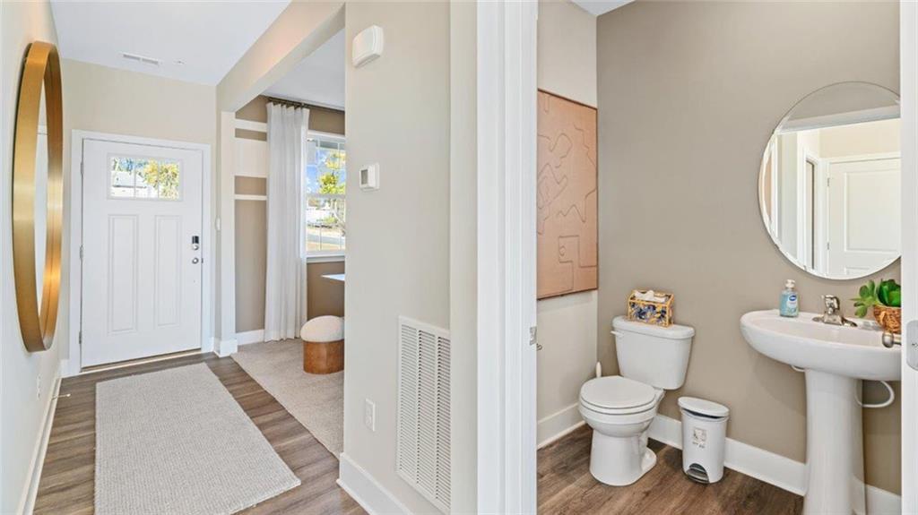 100 Crabapple Lane Beaver Falls, PA 15010 - Photo 2 of 28 a bathroom with a toilet sink and a mirror