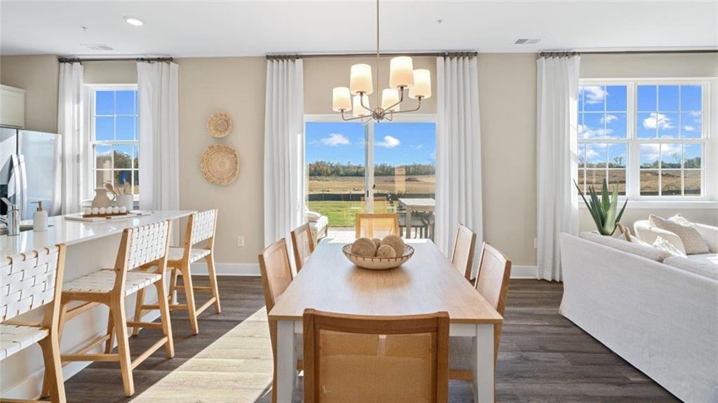 100 Crabapple Lane Beaver Falls, PA 15010 - Photo 10 of 28 a view of a dining room with furniture a chandelier and wooden floor