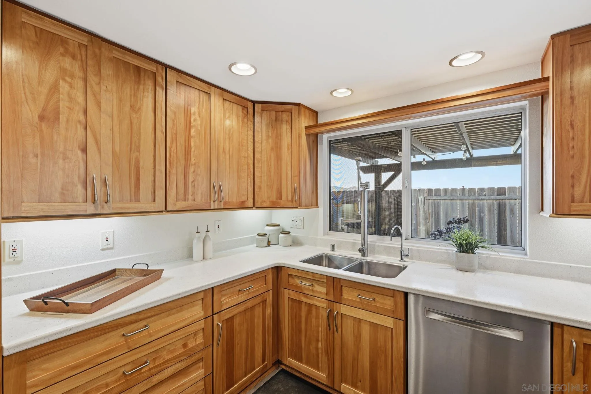 17570 Montero Road San Diego, CA 92128 - Photo 13 of 40 a kitchen with a sink cabinets and window