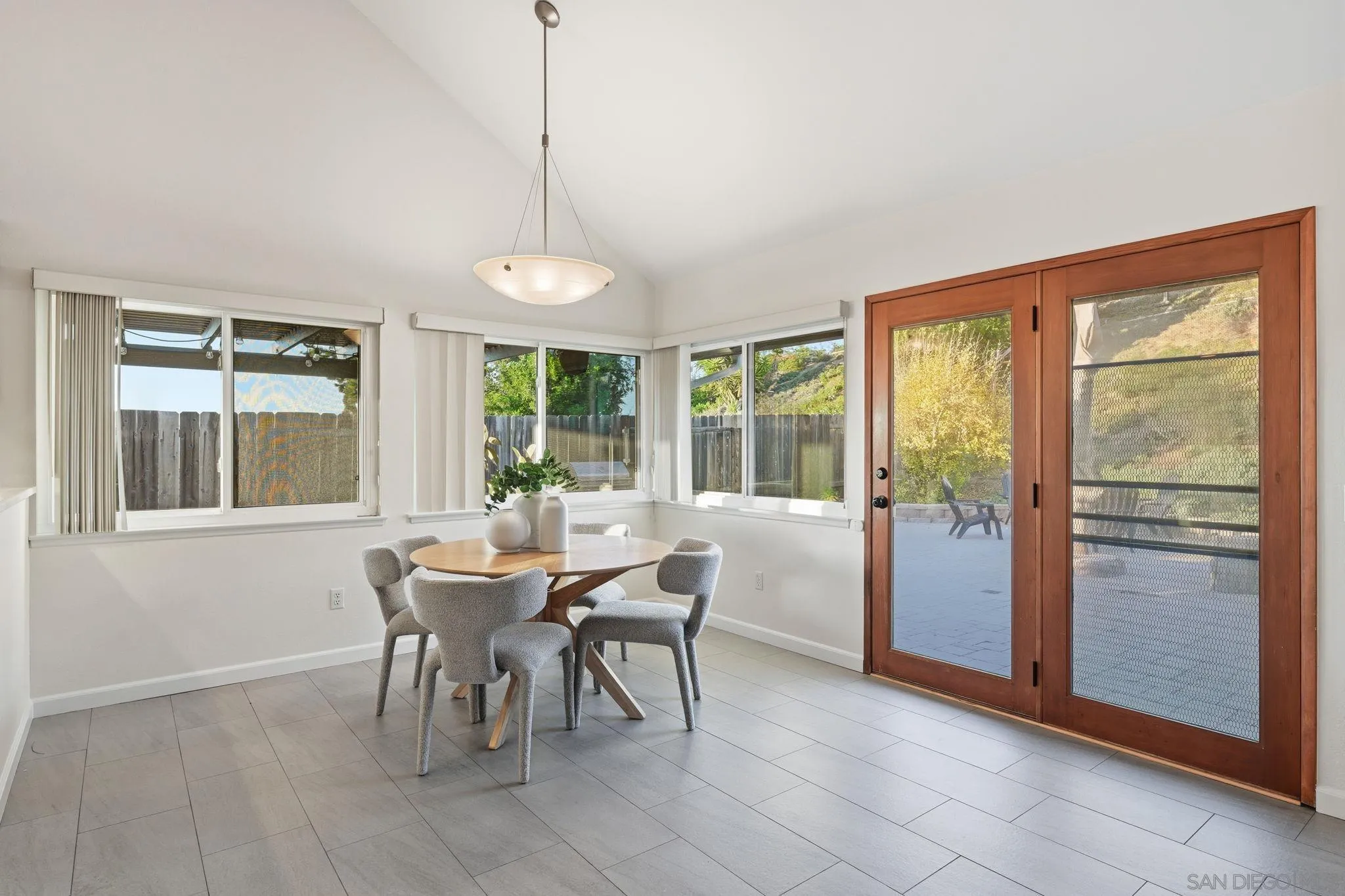 17570 Montero Road San Diego, CA 92128 - Photo 15 of 40 a dining room with furniture and window