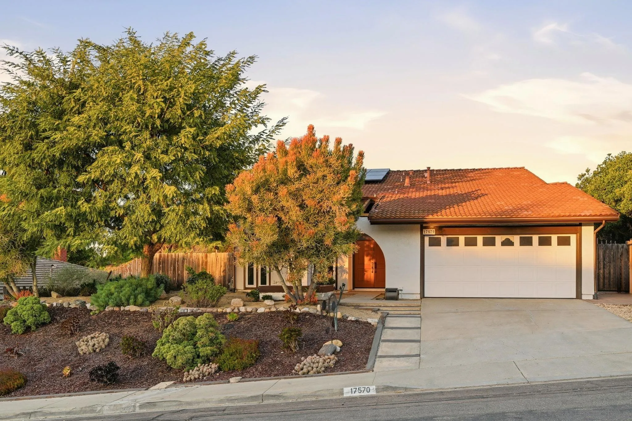 17570 Montero Road San Diego, CA 92128 - Photo 2 of 40 a front view of a house with a yard
