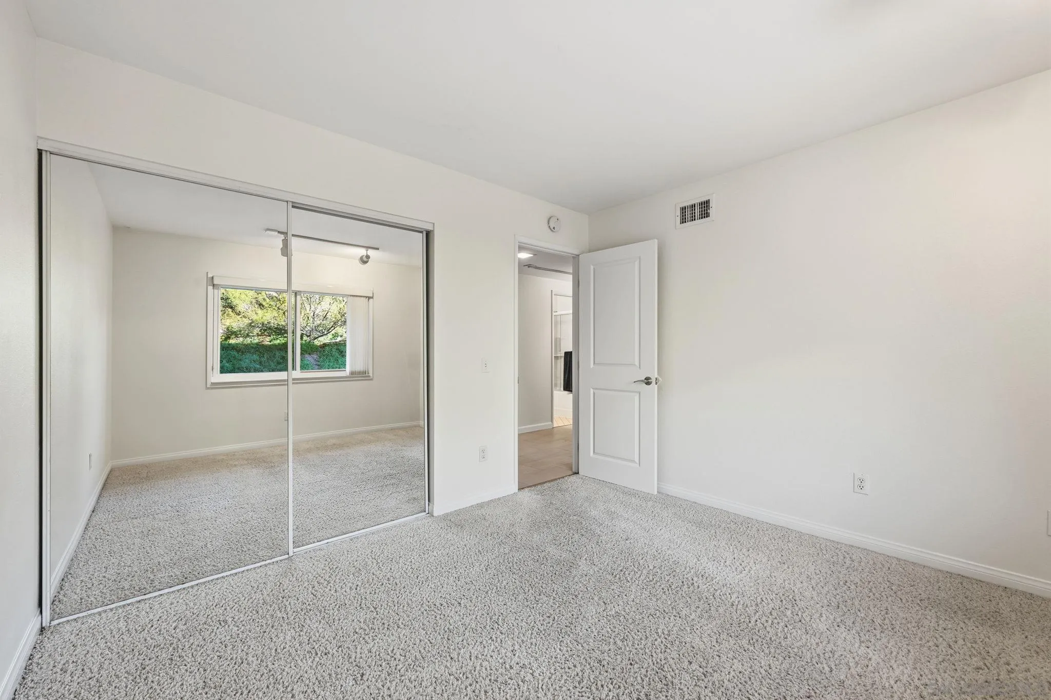 17570 Montero Road San Diego, CA 92128 - Photo 23 of 40 an empty room with a bathroom and a window