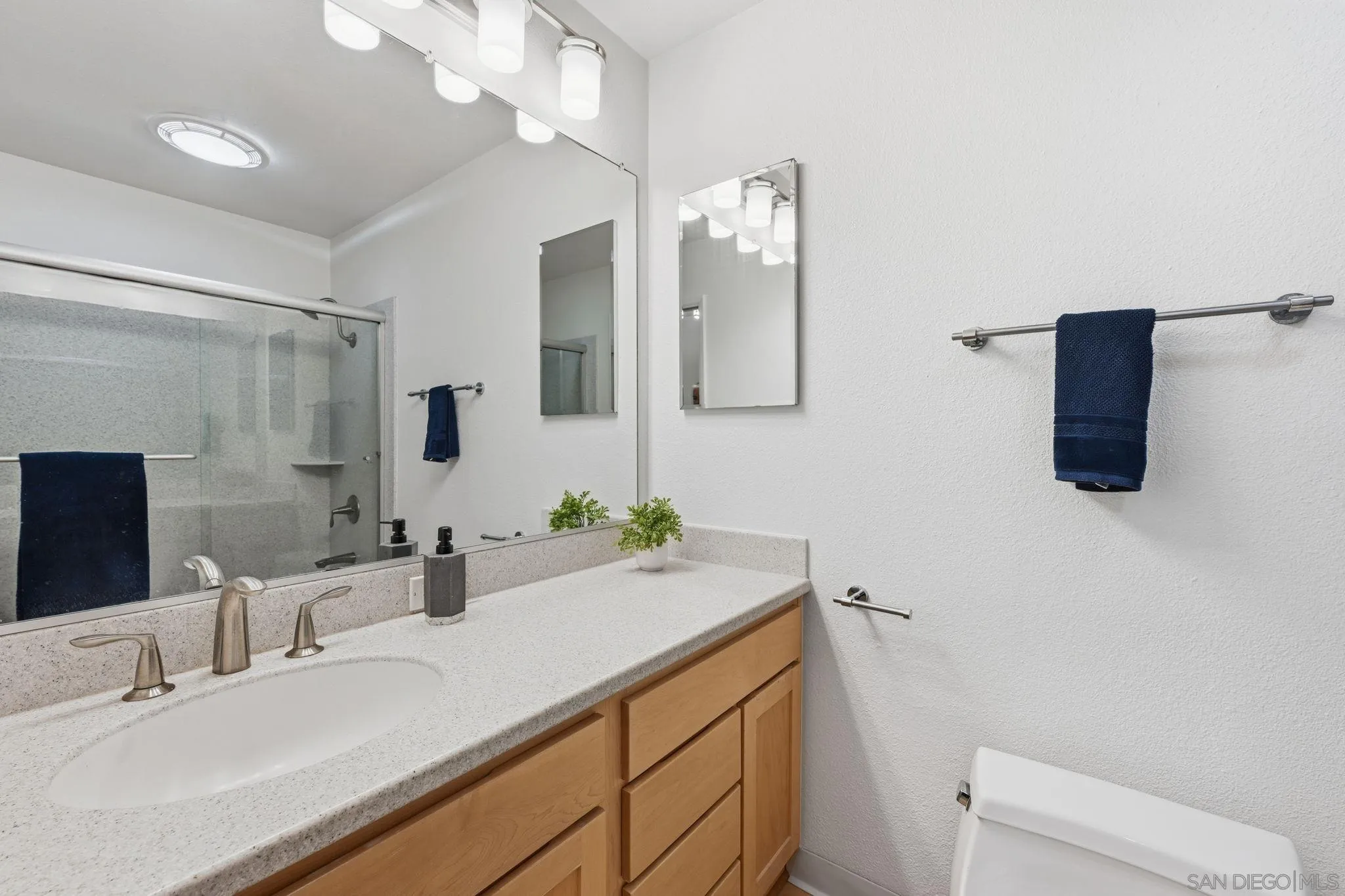17570 Montero Road San Diego, CA 92128 - Photo 26 of 40 a bathroom with a sink vanity granite and toilet