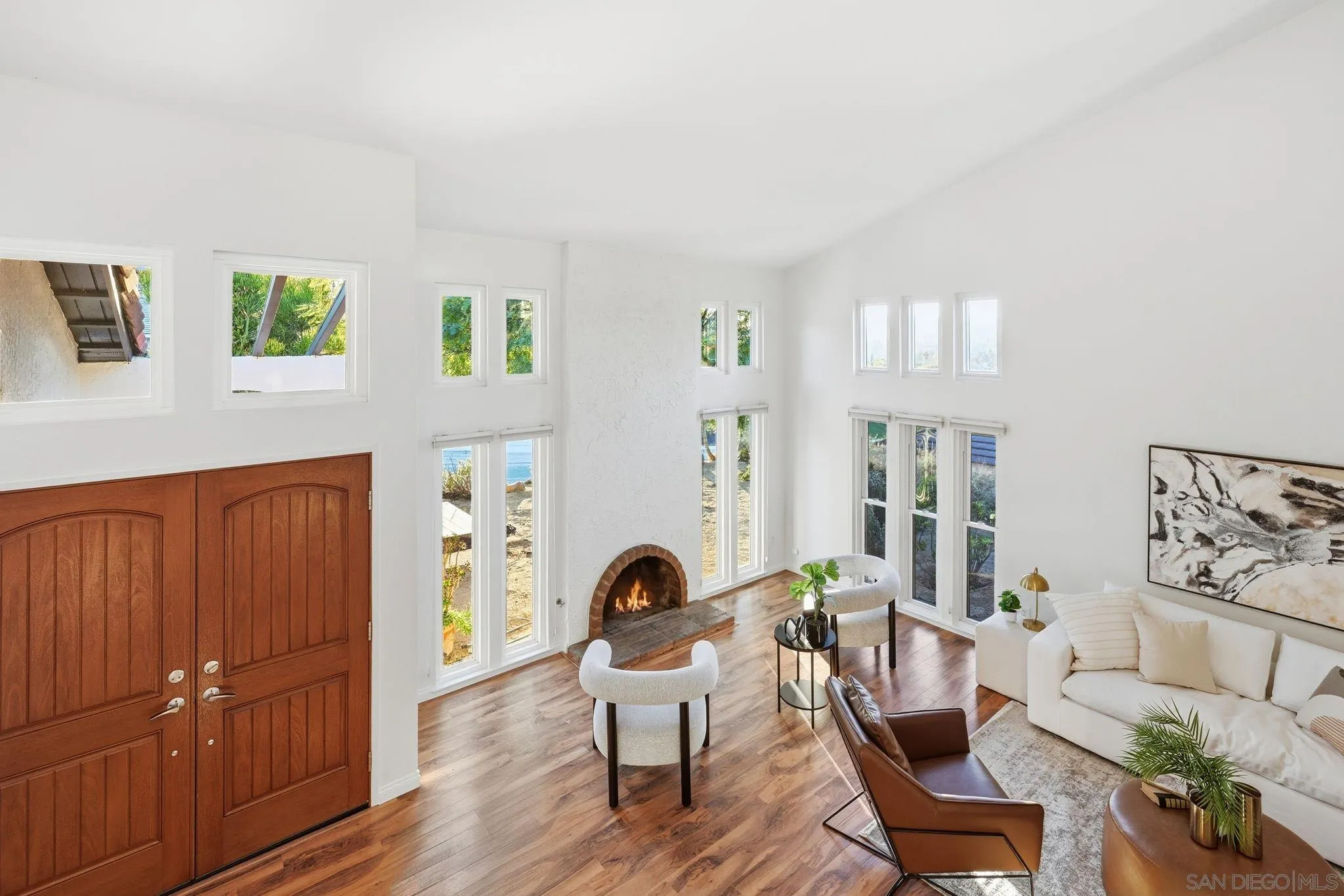 17570 Montero Road San Diego, CA 92128 - Photo 28 of 40 a living room with furniture and wooden floor