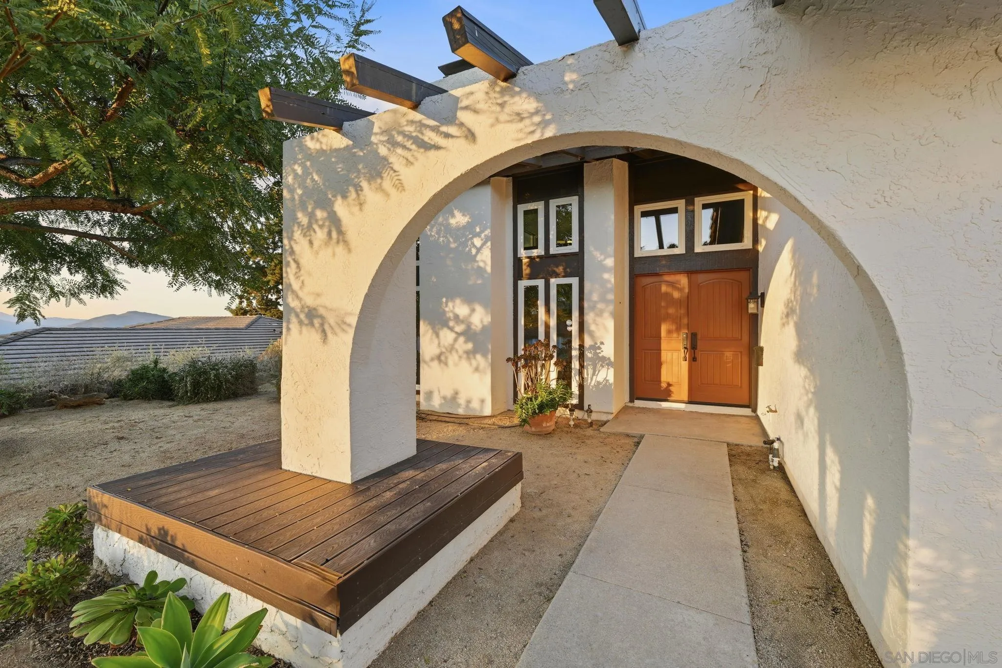 17570 Montero Road San Diego, CA 92128 - Photo 3 of 40 a front view of a house with a yard