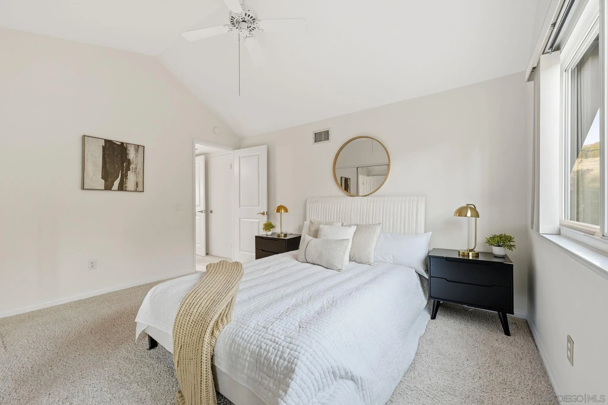 17570 Montero Road San Diego, CA 92128 - Photo 31 of 40 a bedroom with bed and a window