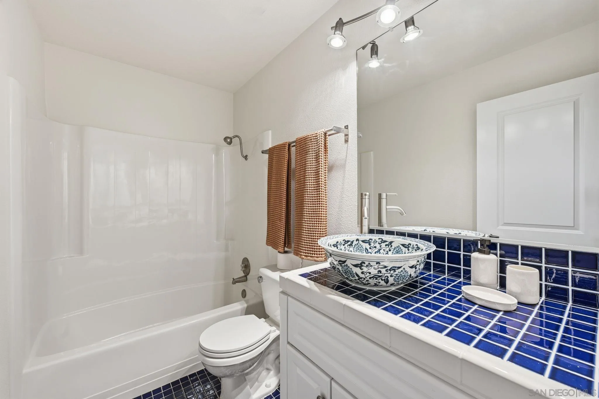 17570 Montero Road San Diego, CA 92128 - Photo 33 of 40 a bathroom with a bathtub shower sink and toilet