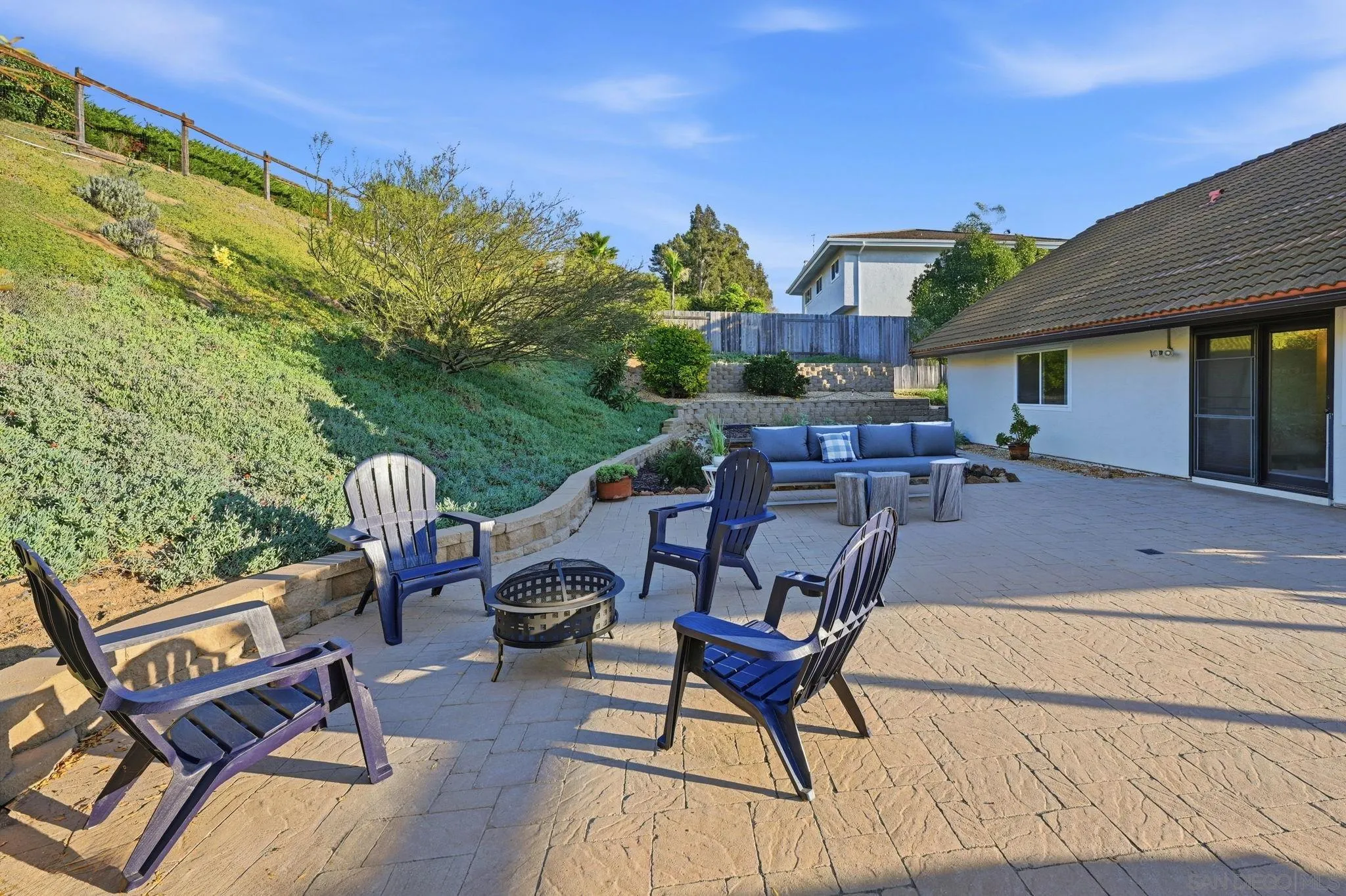 17570 Montero Road San Diego, CA 92128 - Photo 36 of 40 a view of a patio with table and chairs with wooden floor and fence