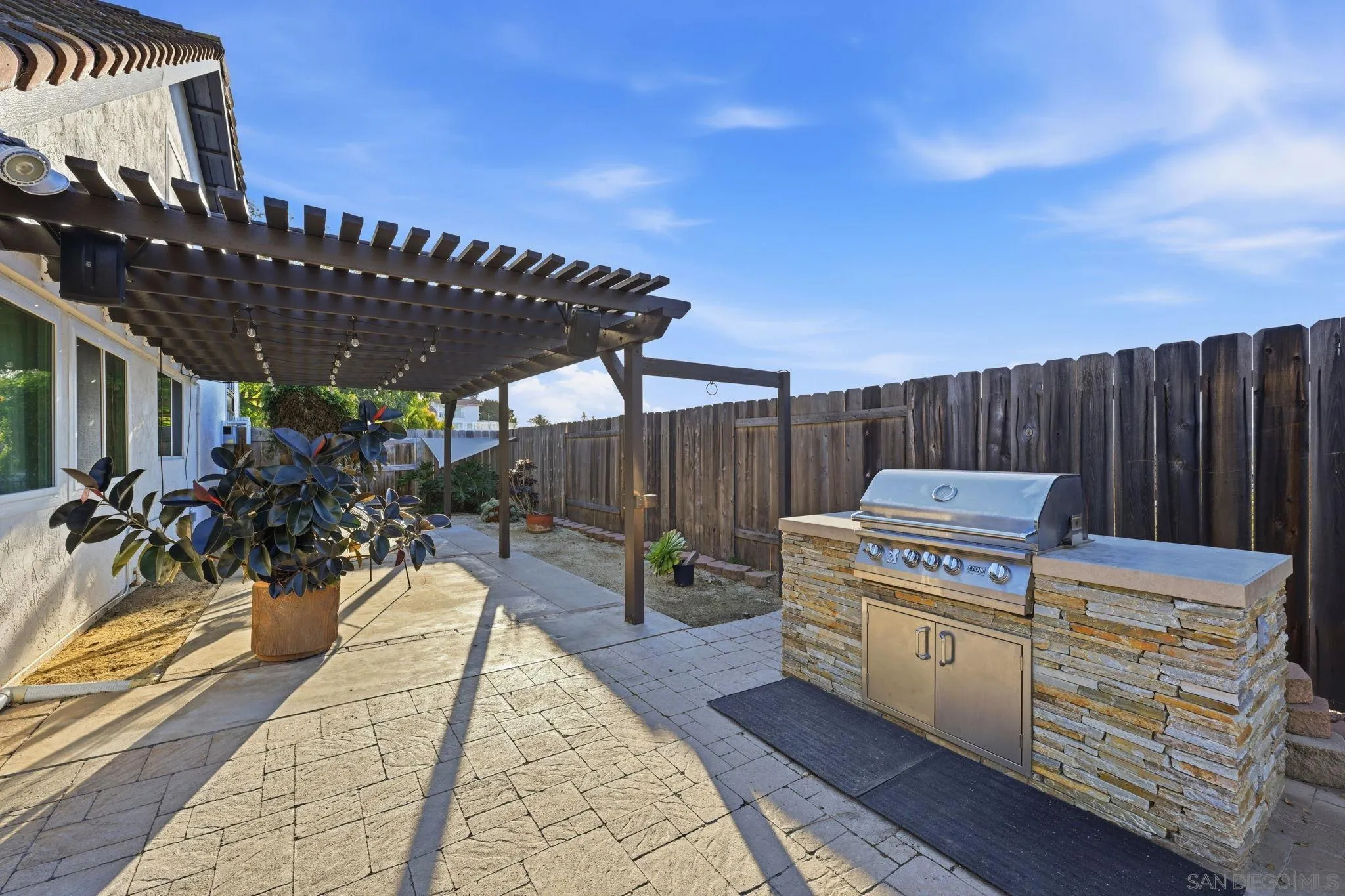 17570 Montero Road San Diego, CA 92128 - Photo 37 of 40 a view of a backyard with sitting area