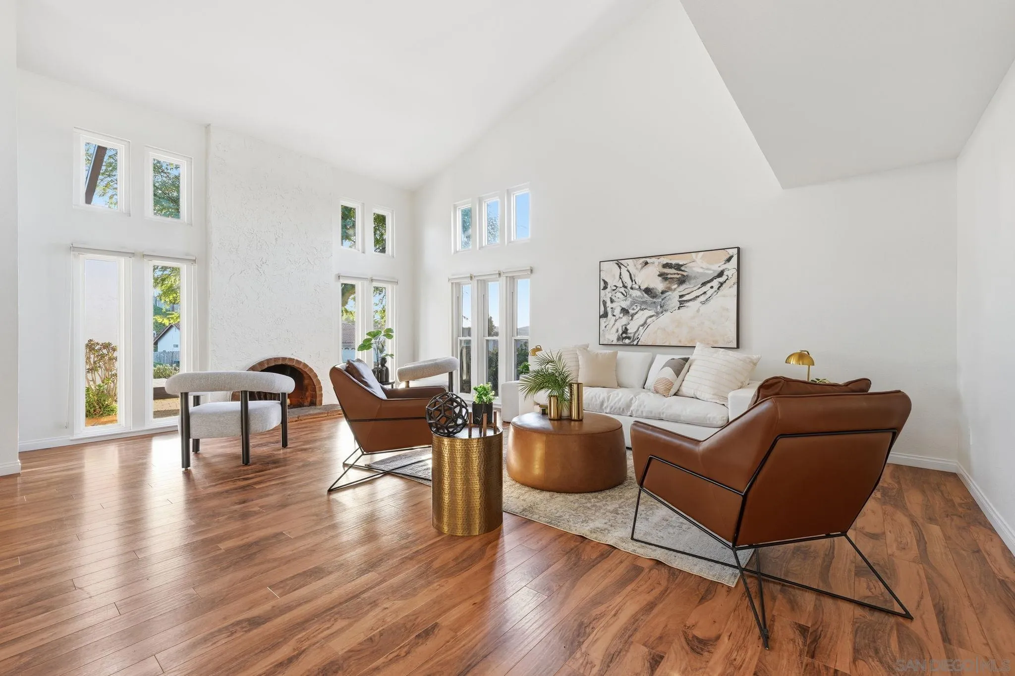 17570 Montero Road San Diego, CA 92128 - Photo 5 of 40 a living room with fireplace furniture and a wooden floor