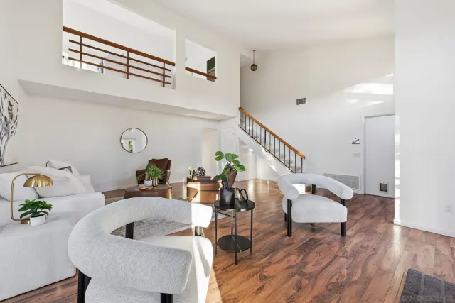 a bathroom with a sink vanity granite and toilet