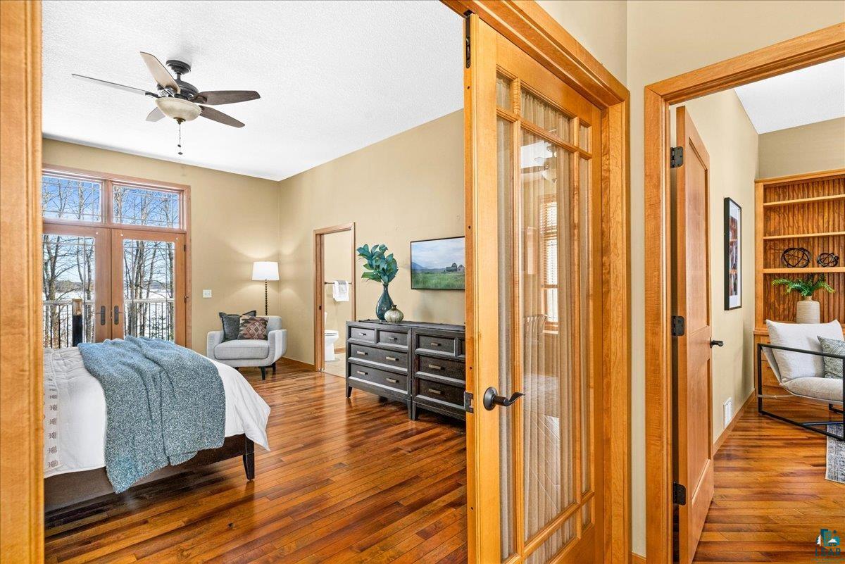 92598 Spells Road Sturgeon Lake, MN 55783 - Photo 19 of 60 Bedroom featuring french doors, hardwood / wood-style flooring, a ceiling fan, and access to exterior
