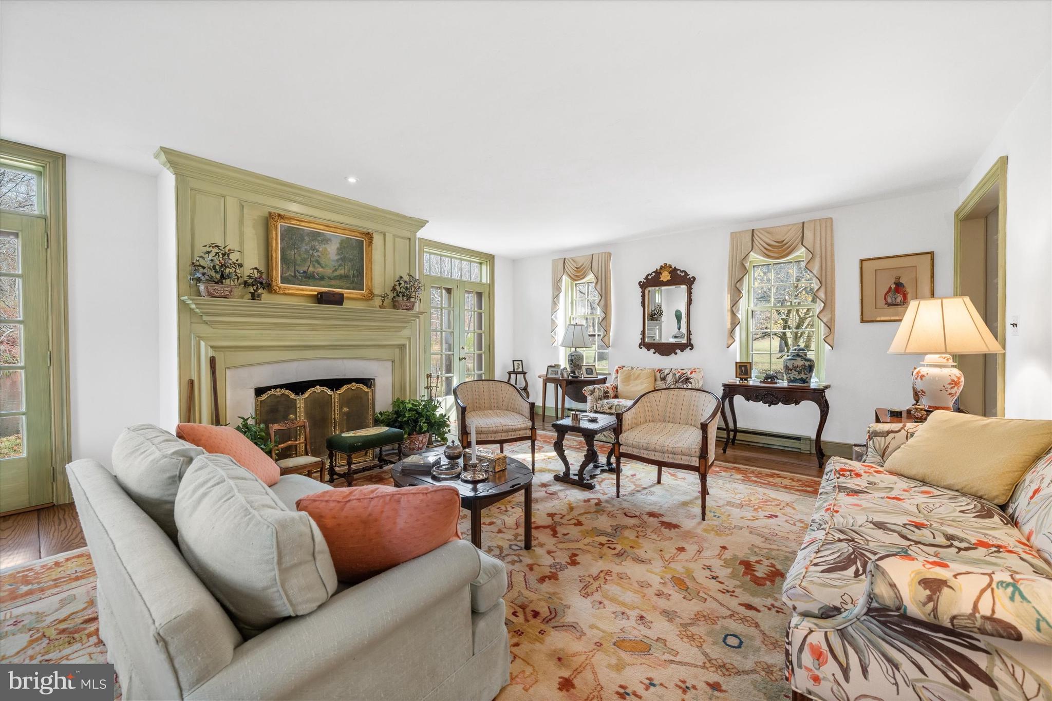 975 Brintons Bridge Road West Chester, PA 19382 - Photo 12 of 80 a living room with furniture and a fireplace