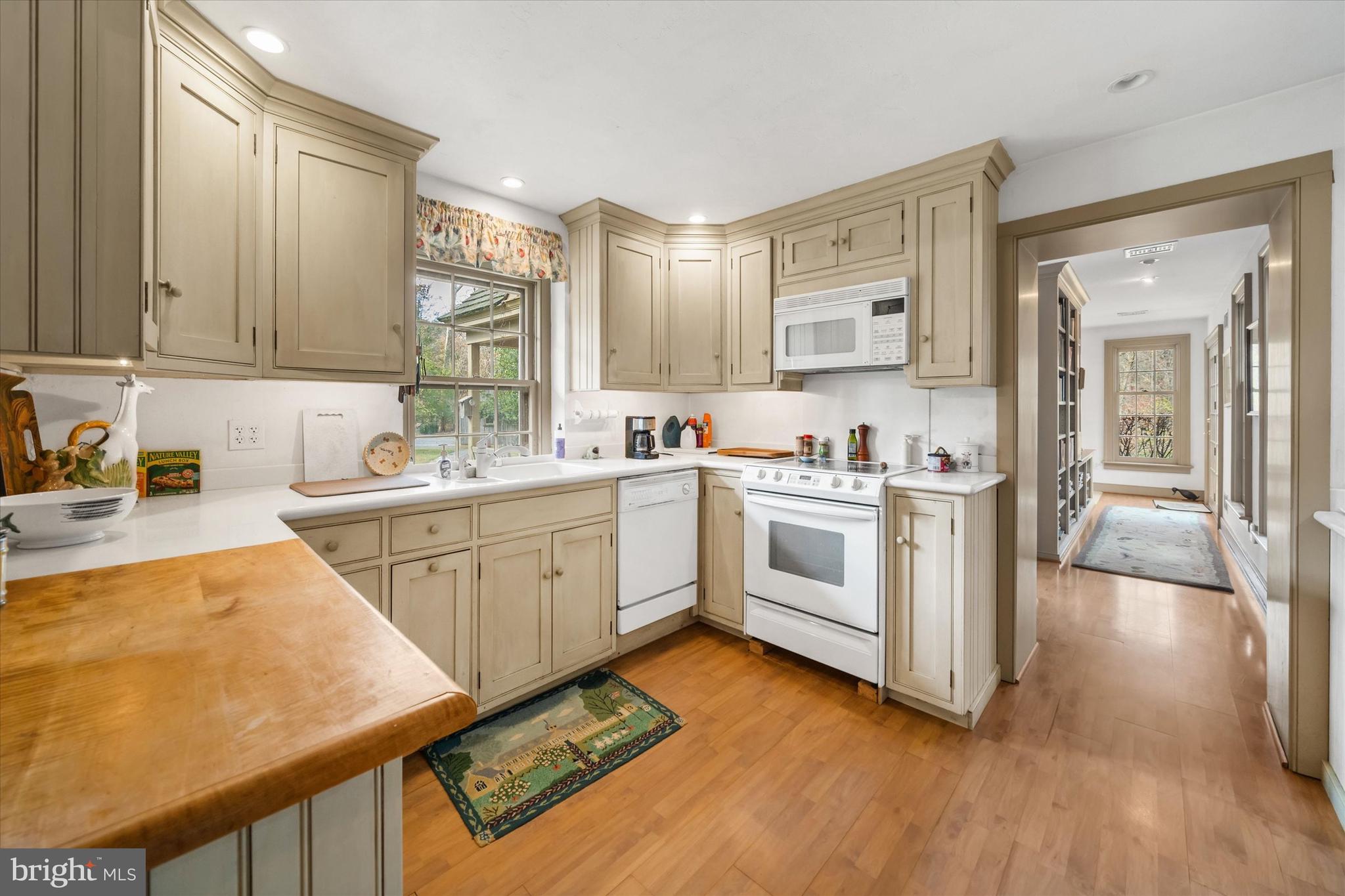 975 Brintons Bridge Road West Chester, PA 19382 - Photo 21 of 80 a kitchen with white cabinets appliances and a sink