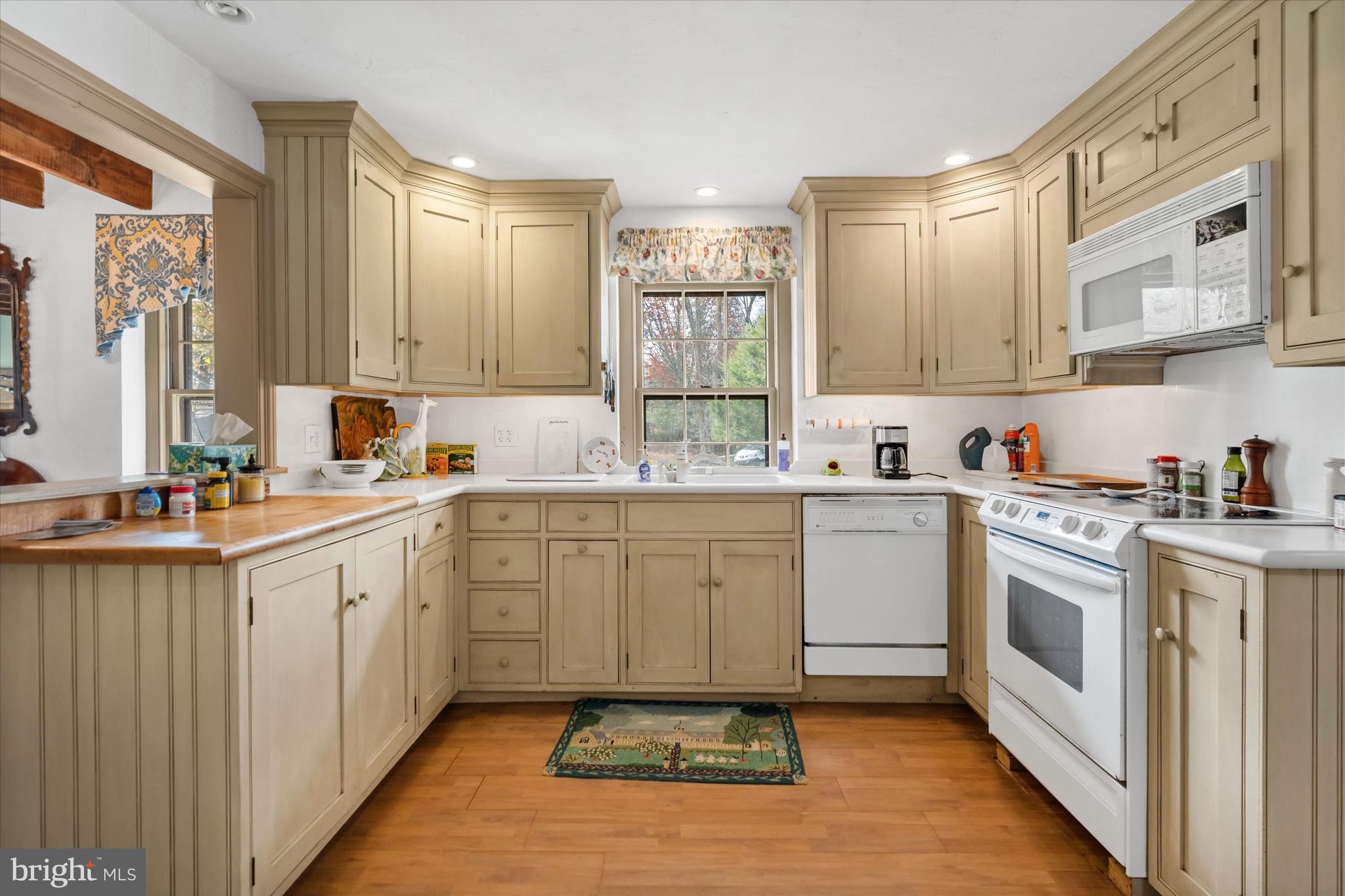 975 Brintons Bridge Road West Chester, PA 19382 - Photo 23 of 80 a kitchen with a sink window and cabinets