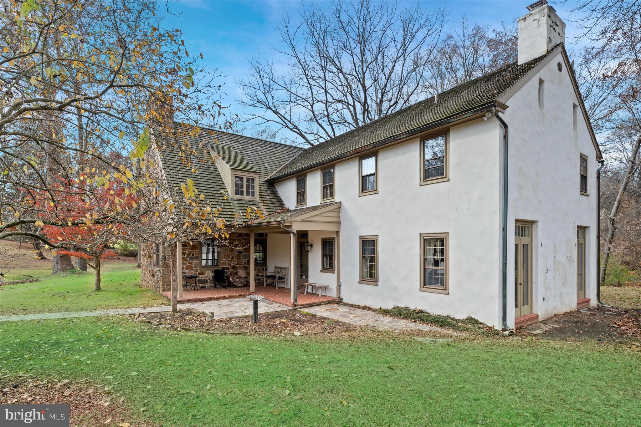 975 Brintons Bridge Road West Chester, PA 19382 - Photo 4 of 80 a view of a white house with a big yard and large tree