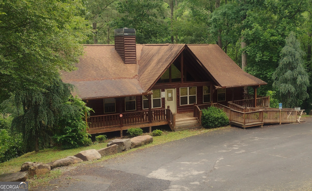 171 B Elk Trail Talking Rock, GA 30175 - Photo 5 of 10 an aerial view of a house with a garden