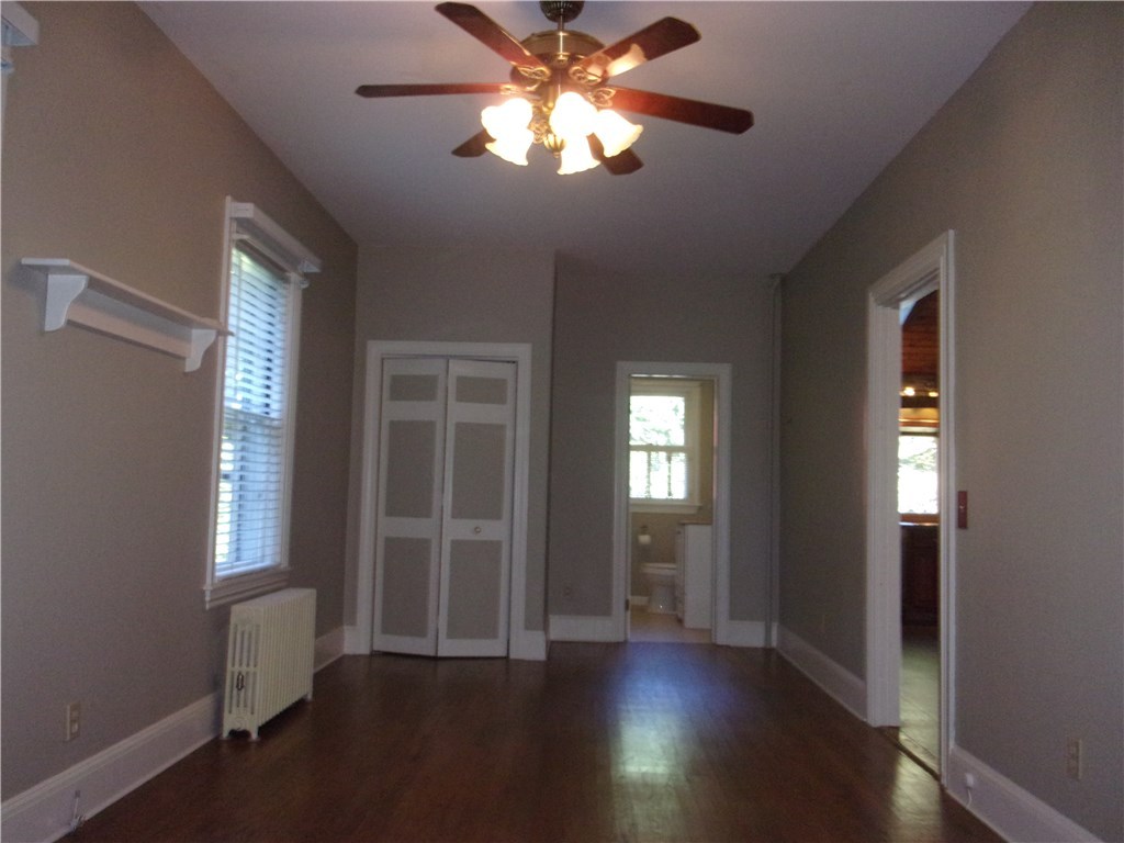 115 Abbott Run Valley Road Cumberland, RI 02864 - Photo 19 of 30 Den, Formal Dining Room, Office. Your choice of use/Half bathroom and closet view. Door leads to Kitchen and Dining Room.