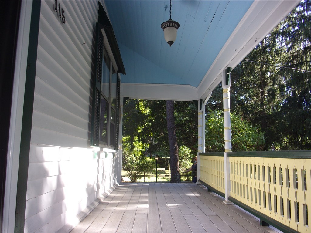 115 Abbott Run Valley Road Cumberland, RI 02864 - Photo 7 of 30 Farmer's Porch/View from left side of dwelling.