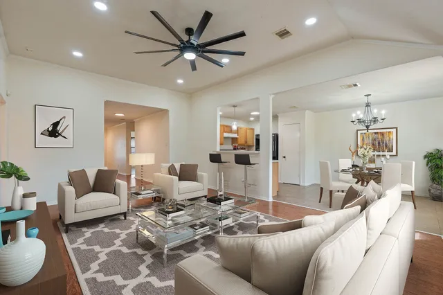 an aerial view of a forest with a yard