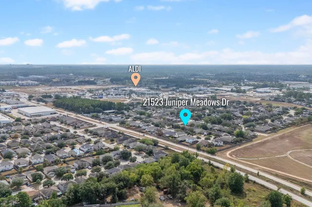 a front view of house with yard and trees around