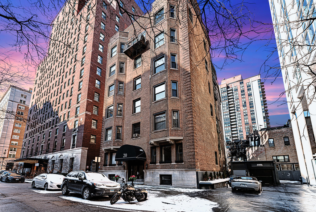 a city street lined with buildings and cars