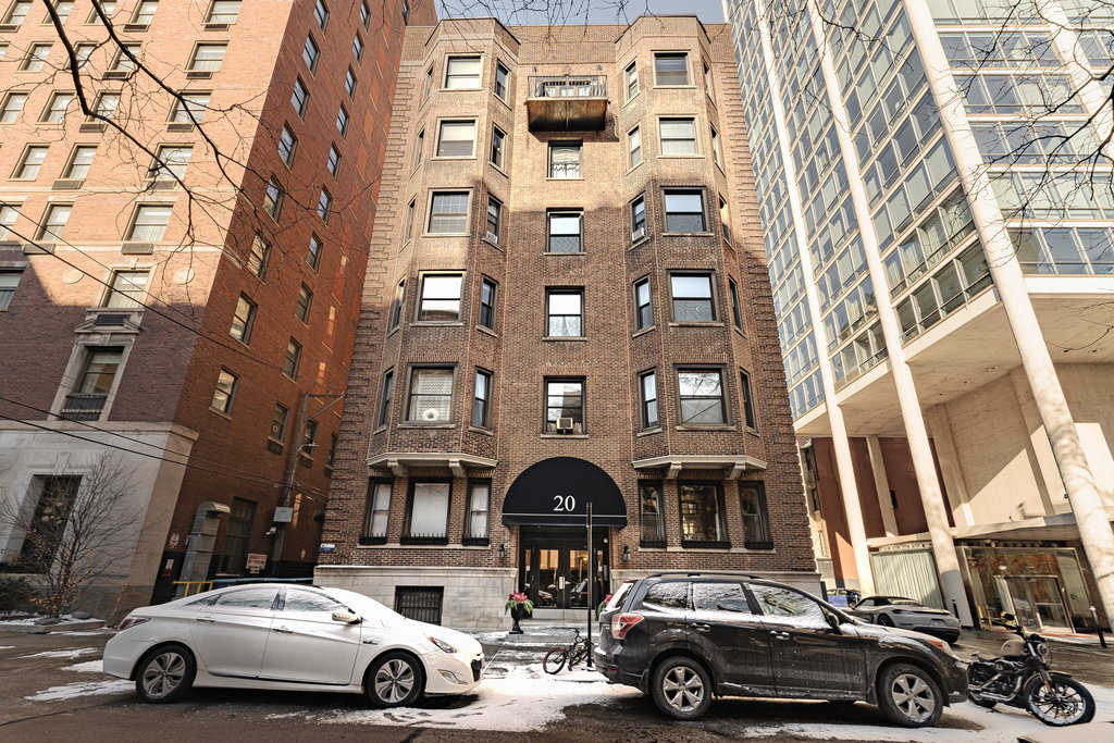 20 East Goethe Street, Unit 104 Chicago, IL 60610 - Photo 17 of 18 a car parked in front of a building