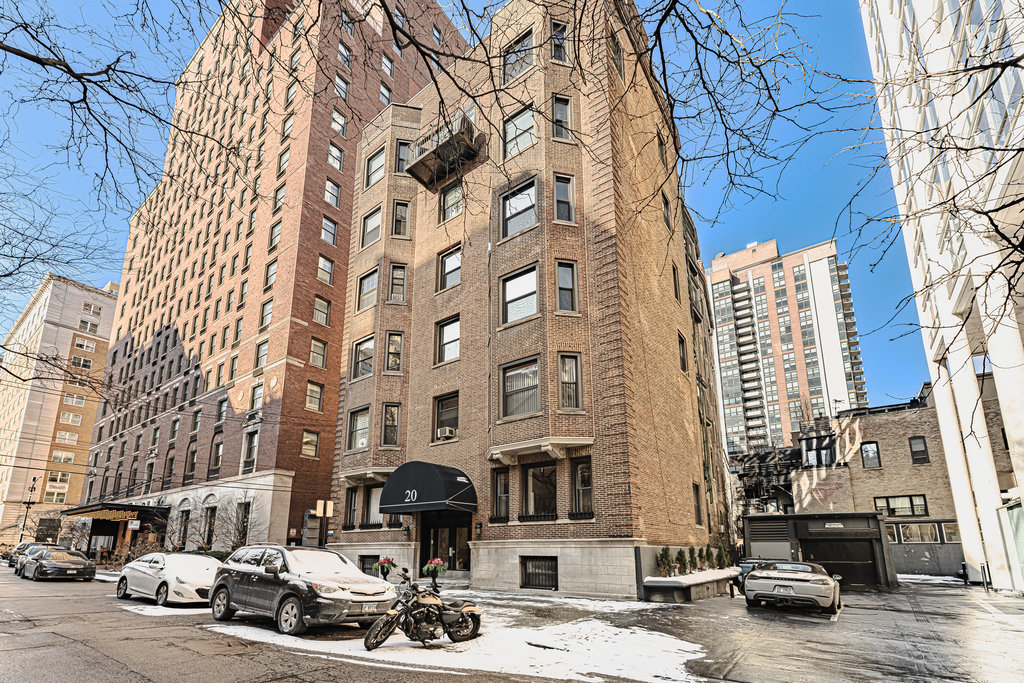 20 East Goethe Street, Unit 104 Chicago, IL 60610 - Photo 18 of 18 a car parked in front of a building