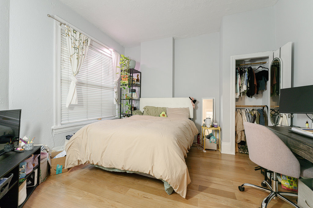 20 East Goethe Street, Unit 104 Chicago, IL 60610 - Photo 7 of 18 a bedroom with a bed and a flat screen tv