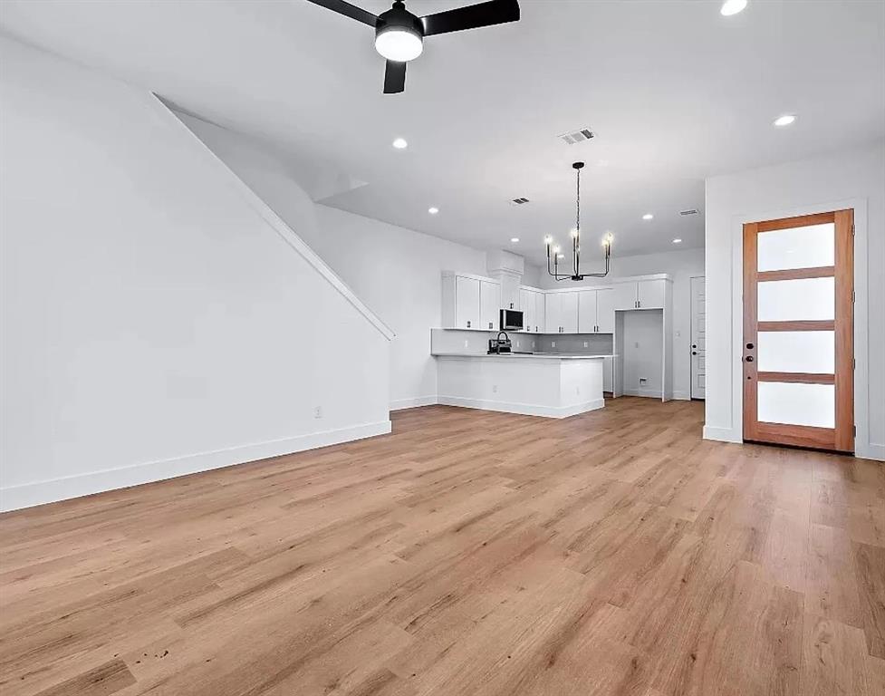 1605 Logan Street Fort Worth, TX 76104 - Photo 2 of 17 a view of a kitchen with a sink and a stove top oven