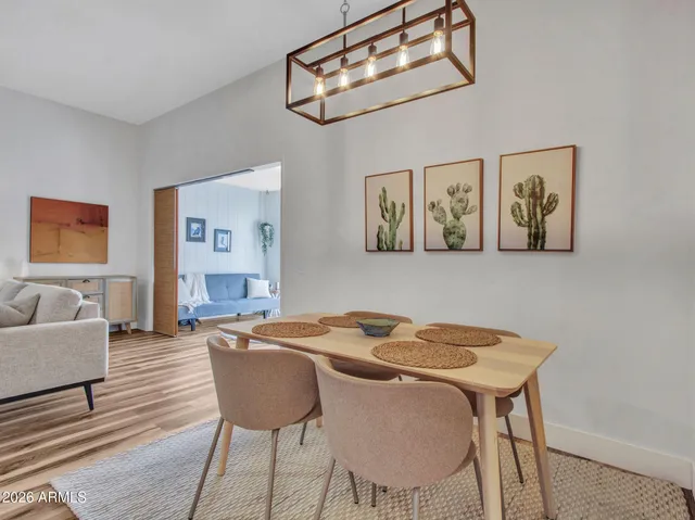 a view of a dining room with furniture and wooden floor