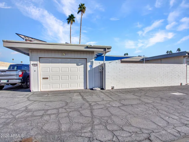 a view of a house with a garage and a tub