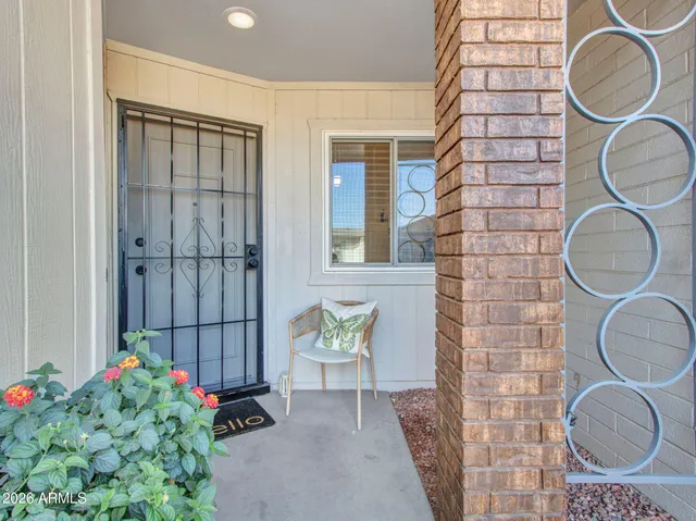 a bathroom with a sink mirror and toilet