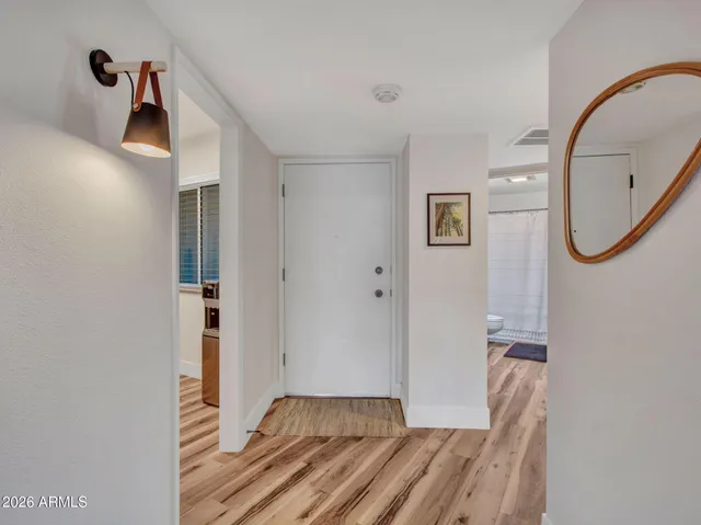 a view of hallway with mirror