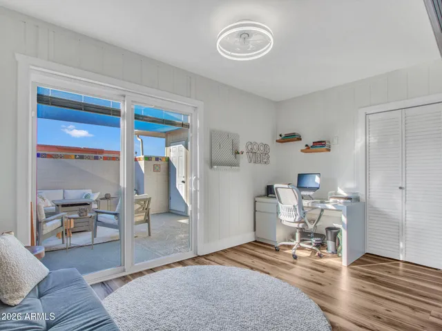 a living room with furniture and a rug