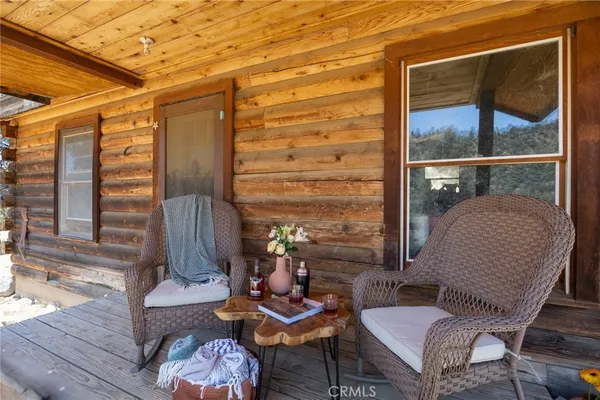 a outdoor living space with furniture and a rug