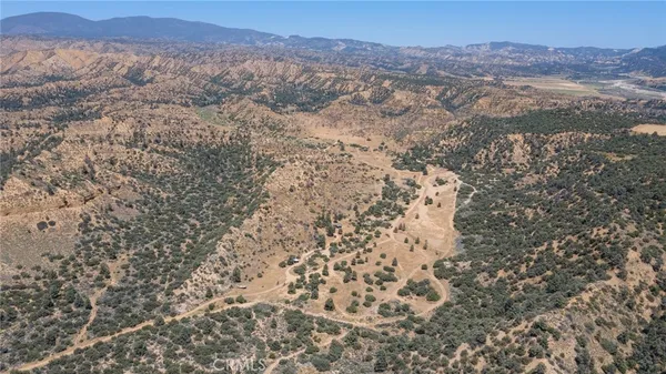 a view of a mountain range with trees