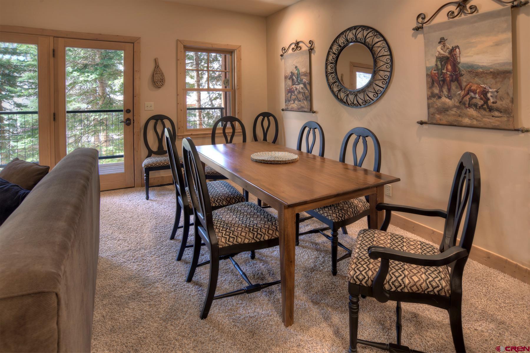 67 Travertine Trail, Unit 67 Durango, CO 81301 - Photo 13 of 35 a dining room with furniture and window
