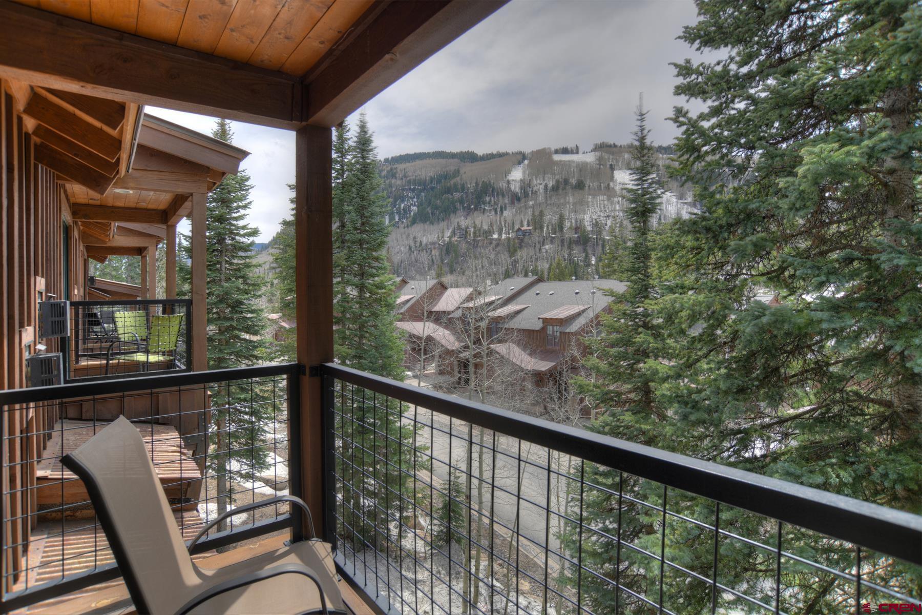 67 Travertine Trail, Unit 67 Durango, CO 81301 - Photo 21 of 35 a view of a balcony with chair